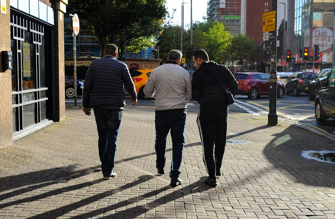 man walking city street